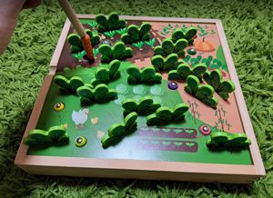 Montessori stalo žaidimas - kirmėliukai ir daržovės sode